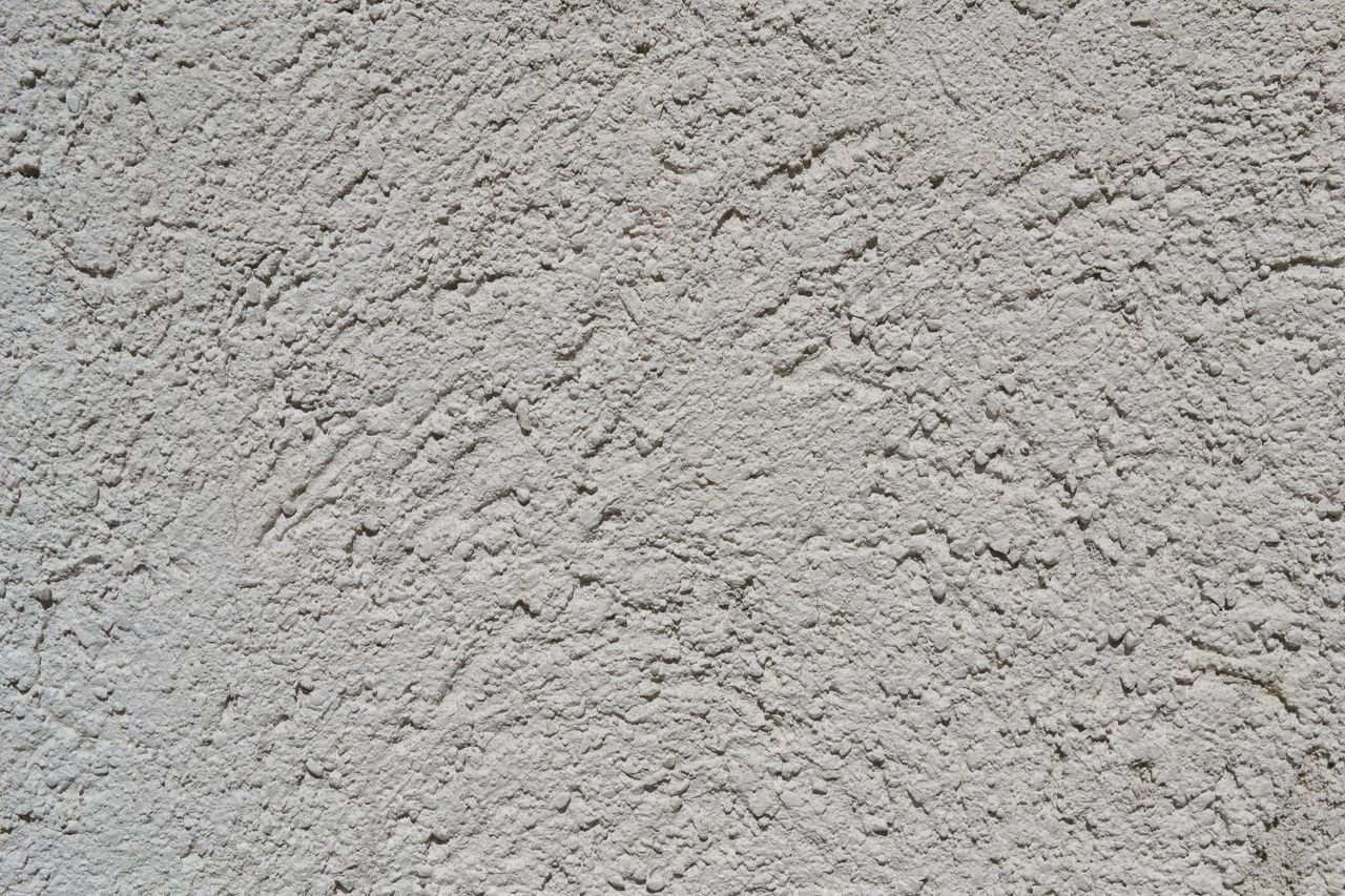 Crafting Captivating Headlines: Your awesome post title goes here Close-up of a light gray stucco wall texture, ideal for backgrounds.