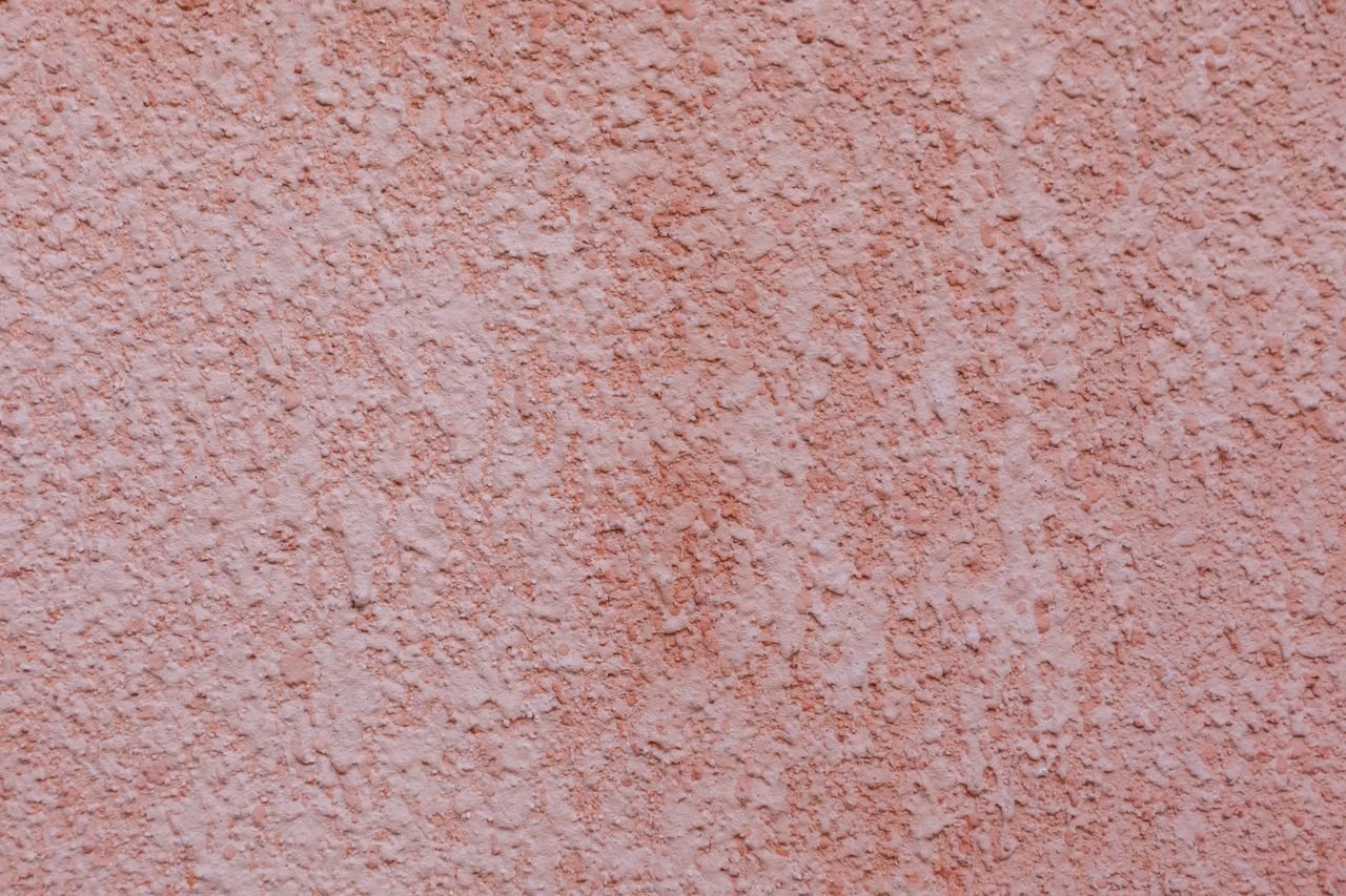 The Art of Drawing Readers In: Your attractive post title goes here Textured background of wall painted in coral light and covered with embossed plaster