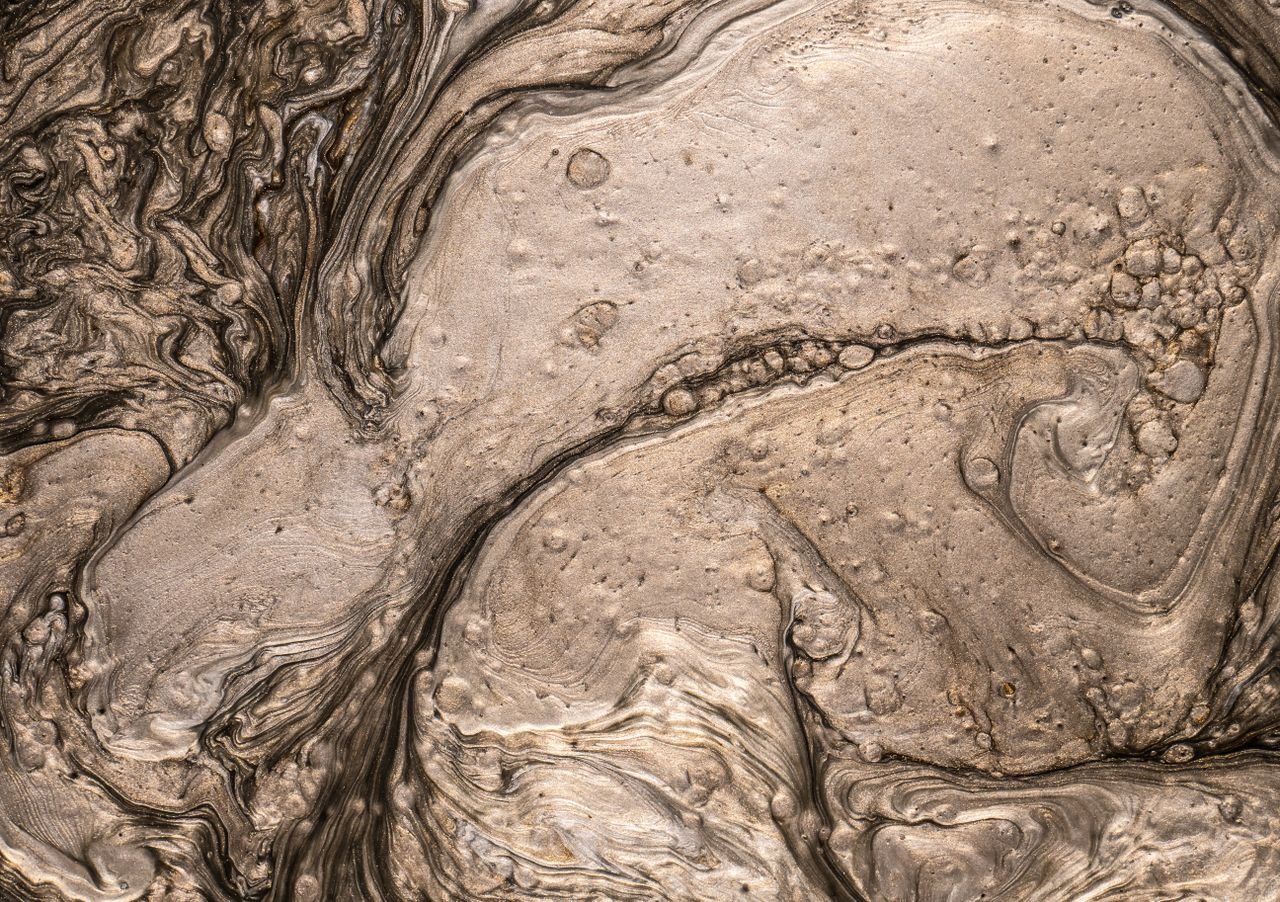 Crafting Captivating Headlines: Your awesome post title goes here Intricate abstract liquid texture displaying swirling patterns in earthy tones.
